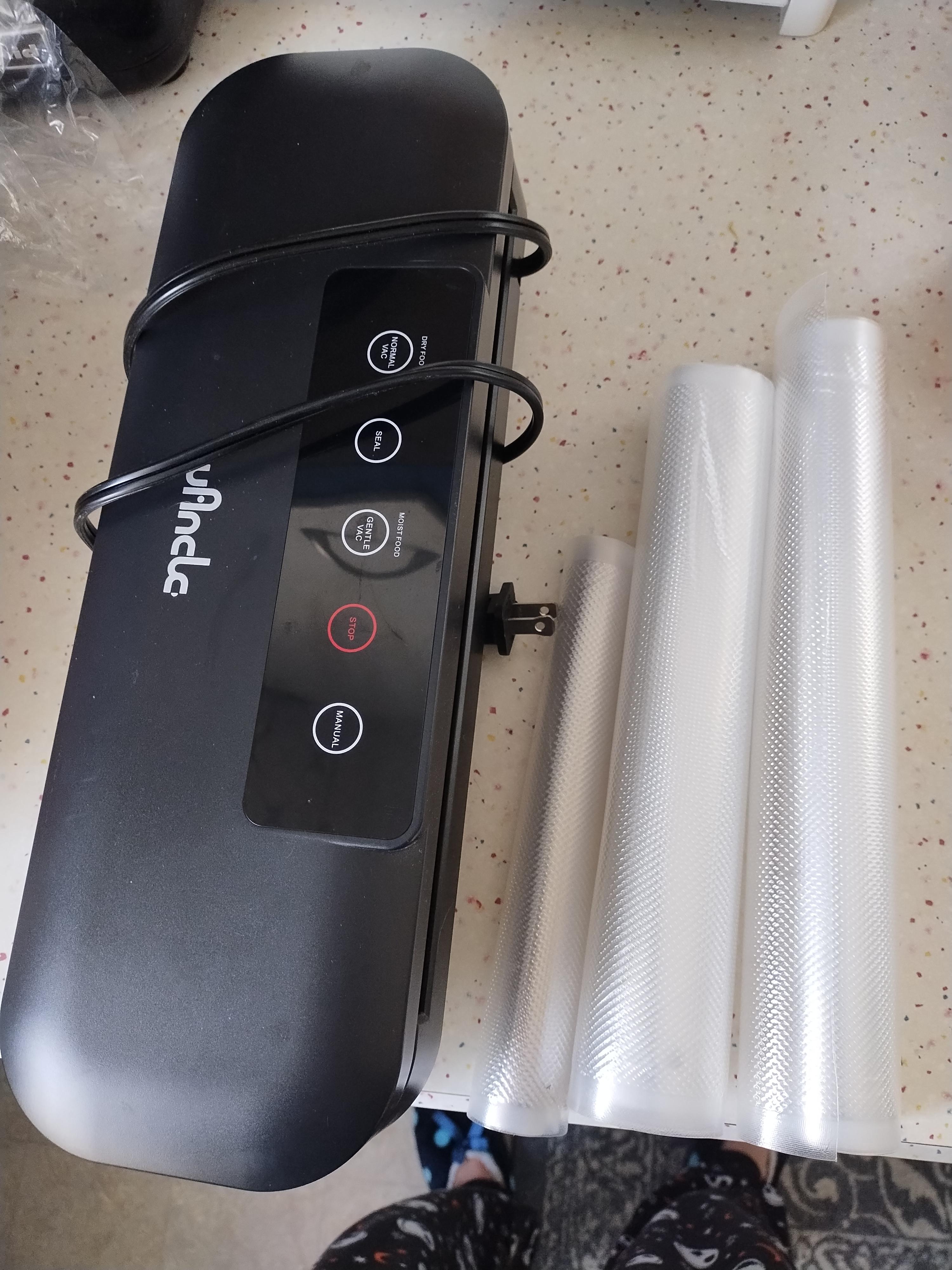 Photo of Vacuum sealer with rolls of plastic