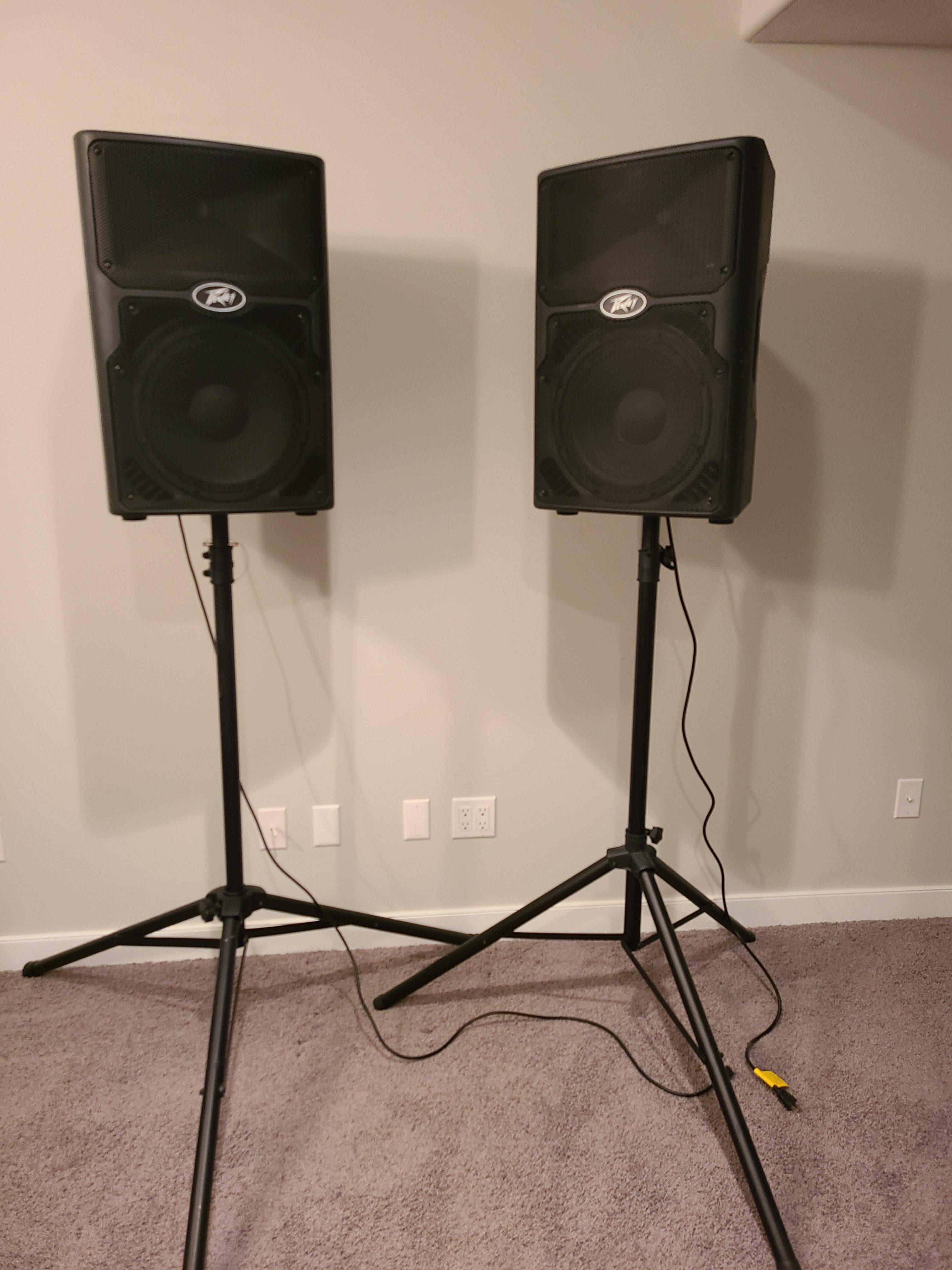 Photo of Peavey PVX P12 800 watt powered concert speakers with stands. Like new condition 