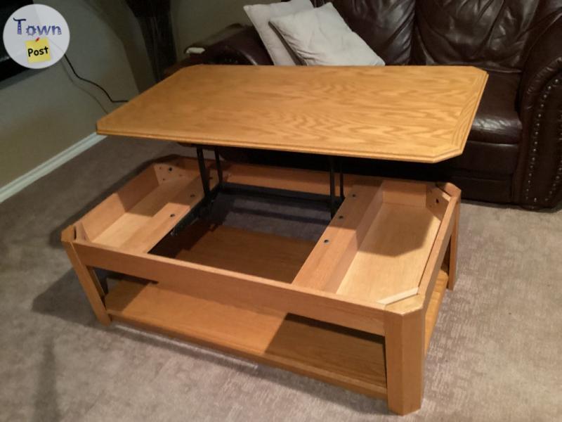 Photo of Oak coffee table. TV stand  decorative vase and sticks